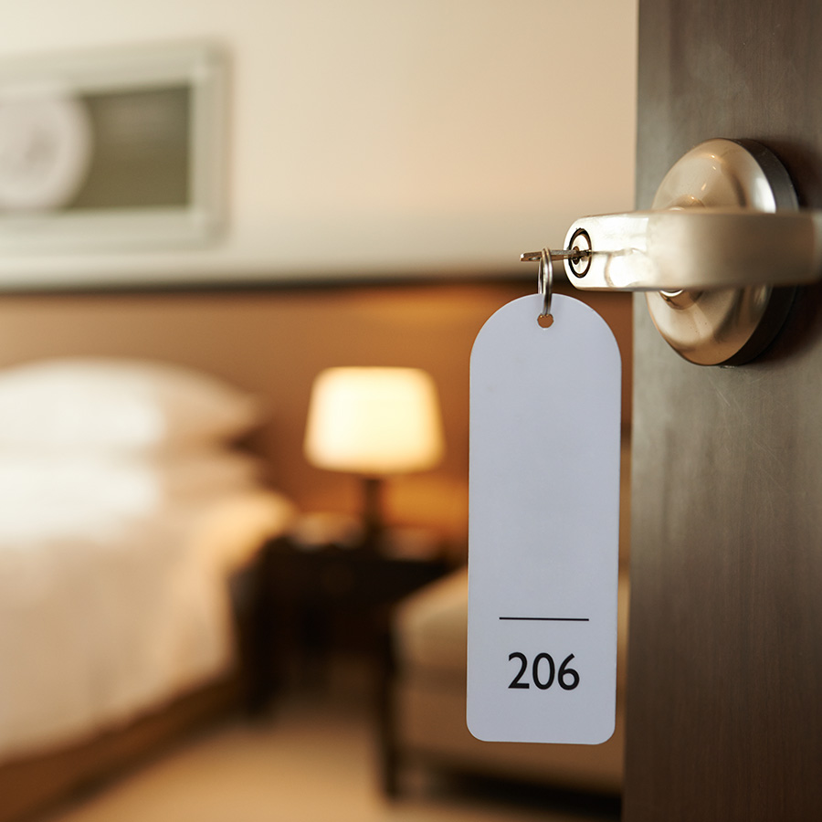 Opened door of hotel room with key in the lock - Bed bugs in a hotel room - commercial bed bugs - Springfield, IL
